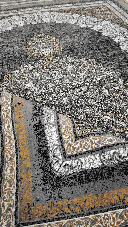 نمای کناره و حاشیه فرش گلاب فیلی: جزئیات حاشیه فرش گلاب فیلی ۵۰۰ شانه با تراکم بالا و طرحهای متقارن، رنگبندی ملایم و نقش برجسته روی بافت نخ پلیاستر.